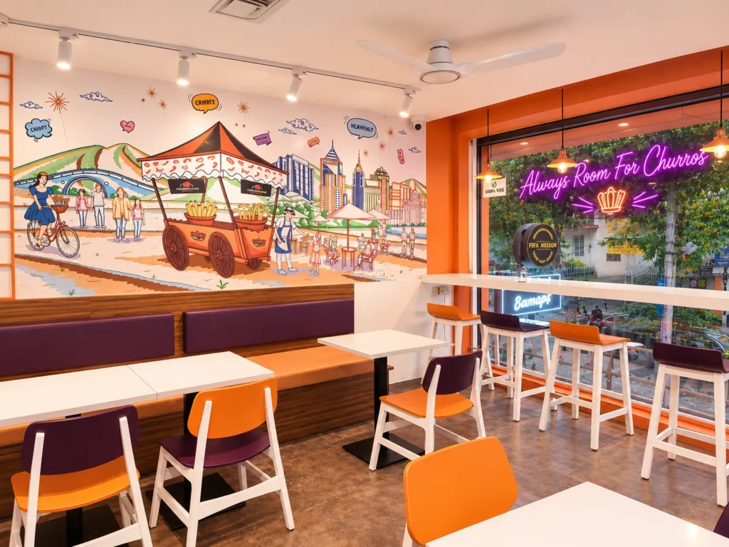 Window bar seating under the "Always Room For Churros" neon at Churroland Koramangala